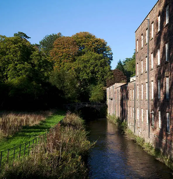 Photo of Mill, stream and trees in Autumn
