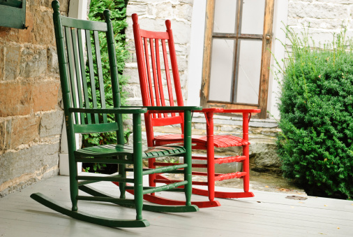 two empty rocking chairs on front porch