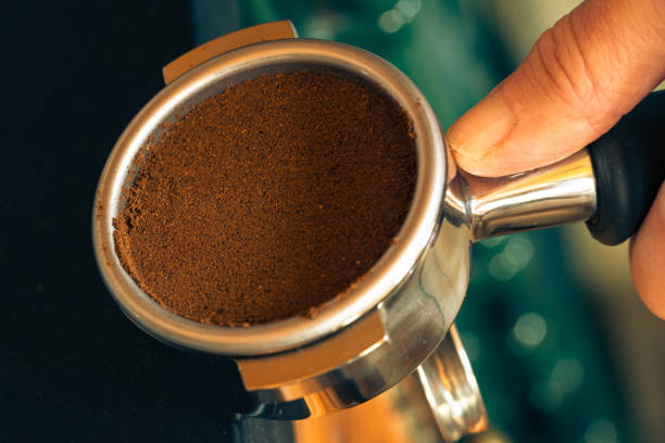 istock Tamping ground coffee in a portafilter 1832349845