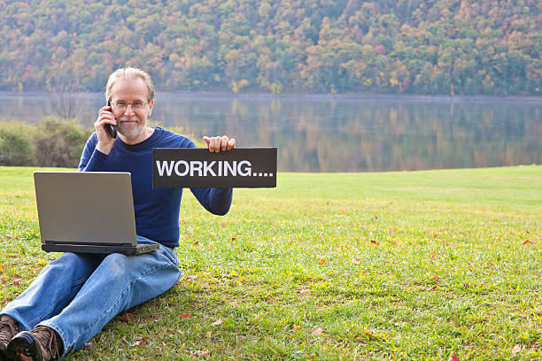 Working In The Park Online stock photo
