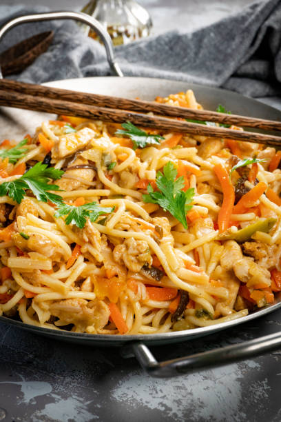 istock Fried noodles with chicken and vegetables. 1832354256