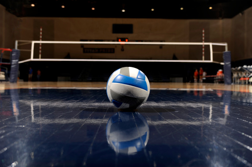 volleyball ball with blurred arena in background