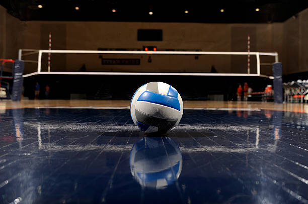 Volleyball in an empty gym stock photo