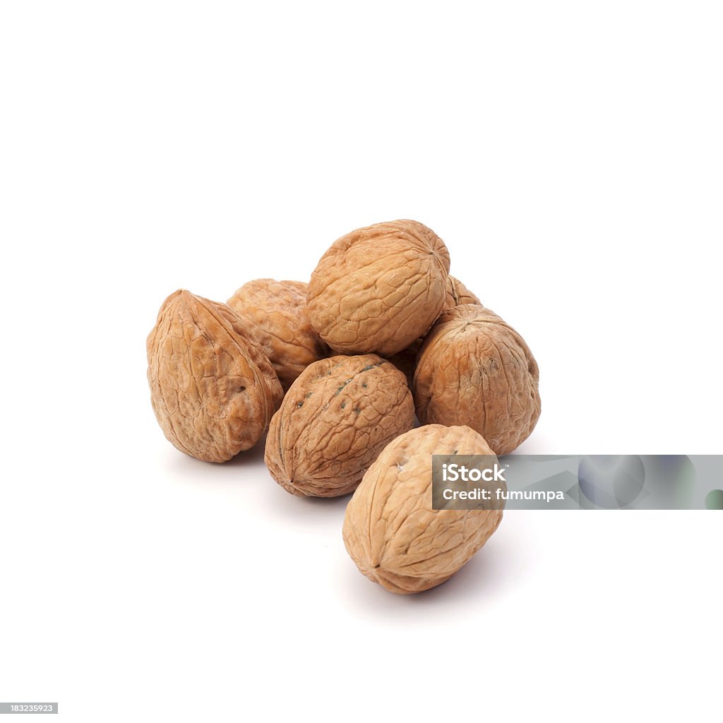 Walnuts walnuts stack on white background with copyspace Close-up Stock Photo