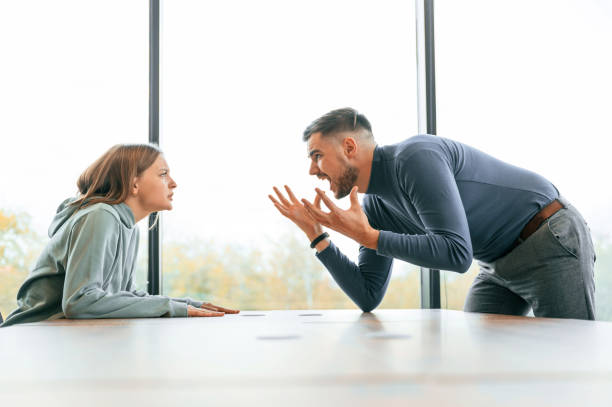 istock Man is screaming at his girlfriend, conception of quarrel 1832360701