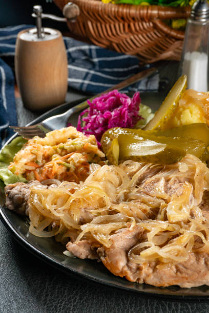 istock Pork tenderloin stewed in onions. 1832360704