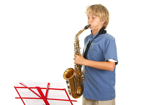 istock Teenage Boy Playing the Saxophone on White Background 183236535