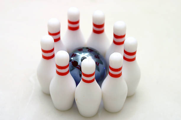 istock teamwork - red stripes pin and blue marble bowling ball 183236680