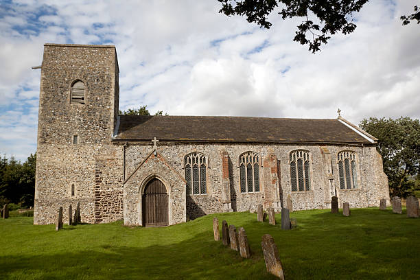 All Saints church at Skeyton, near Aylsham in Norfolk. Cloudy day with occasional sun.