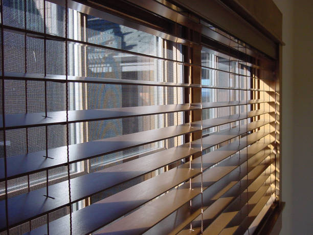 istock Close-up of open wooden window blinds 183237250