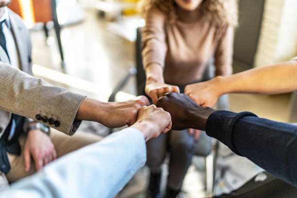 istock Group of multiethnic hands gathered in a circle while on group therapy 1832375740