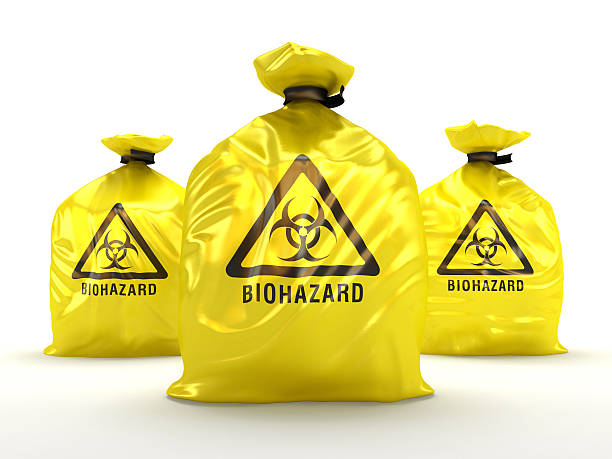 Biohazard bags Yellow biohazard bags isolated on white. biochemical weapon photos stock pictures, royalty-free photos & images