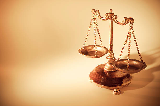 Golden scales of justice Golden scales of justice with copy space. equal arm balance photos stock pictures, royalty-free photos & images