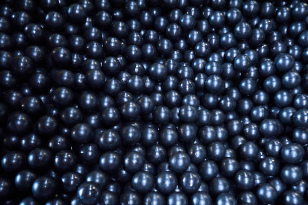 Bright black plastic balls. Textured background for use in the design. Entertainment for children.