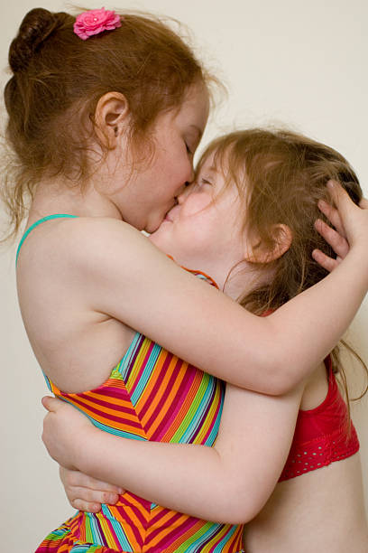 istock Playful kiss among best friends 183238412
