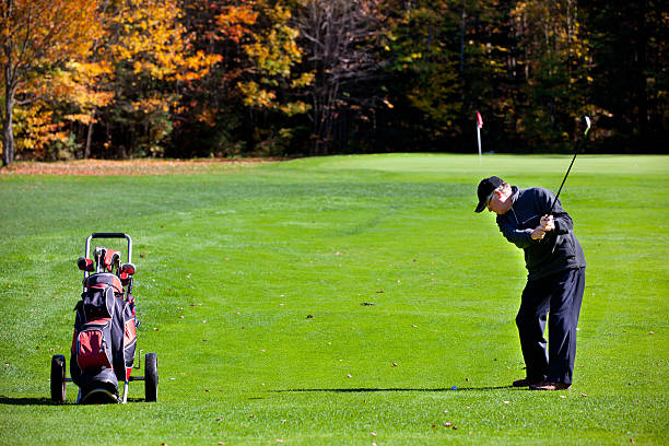 istock Senior Golf Player in Action in Autumn 183238477