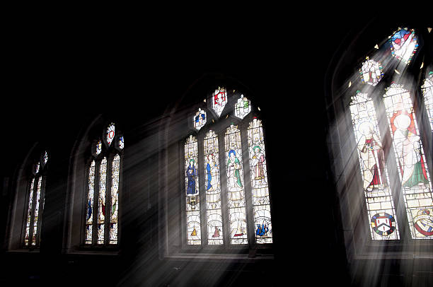 istock sun shining through church windows 183238710