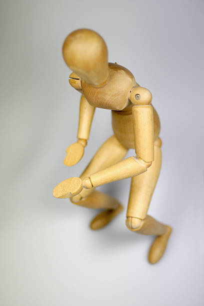 istock Wooden human figurine posing 183239224