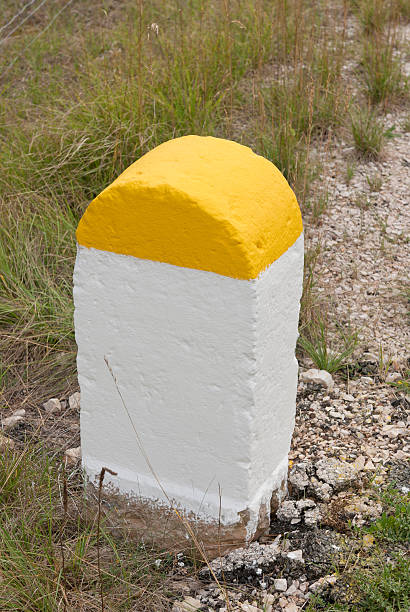 freshly painted milestone a freshly painted milestone distance sign stock pictures, royalty-free photos & images