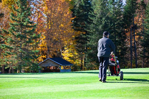 istock Senior Golf Player in Action in Autumn 183240064