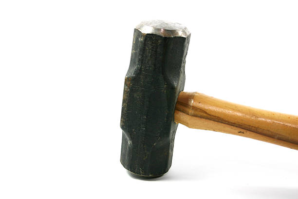 A sledge hammer with a wooden handle on a white background stock photo