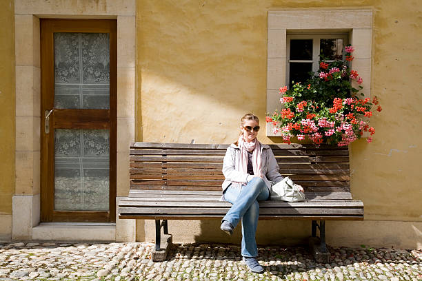 istock Pretty women sitting on a bench 183241025