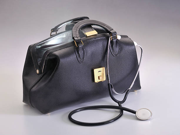 istock Physician's black leather bag with stethoscope opened slightly 183241199