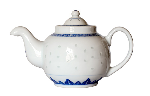 White antique porcelain teapot isolated on white background