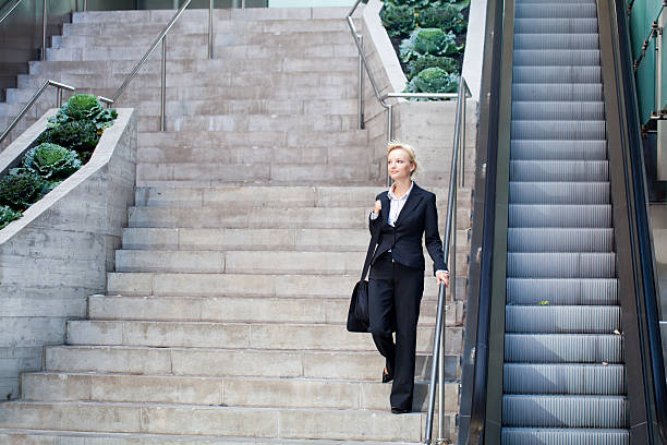 istock Business woman walking on staircase 183241420