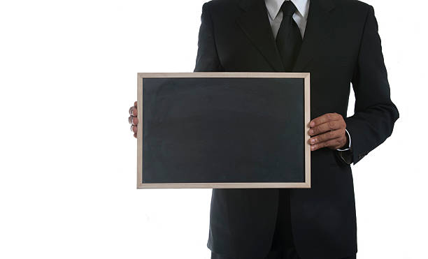 istock Business man holding a blank blackboard 183241584
