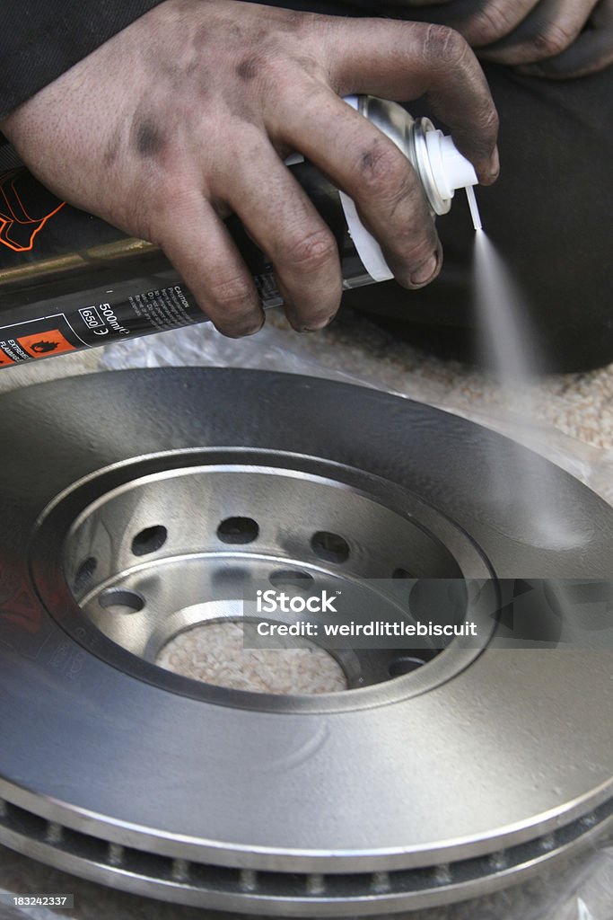 Brake disk cleaner Spray brake disk cleaner in use. Cleaner Stock Photo