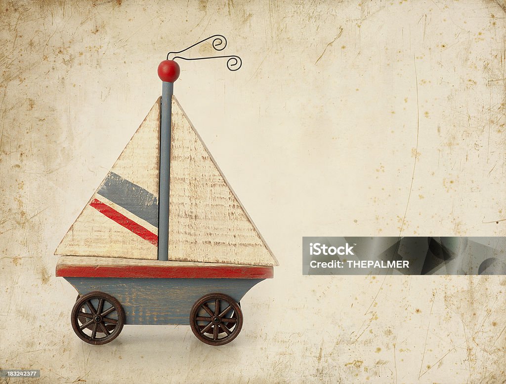 boat on wheels old toy boat on wheels Sailboat Stock Photo