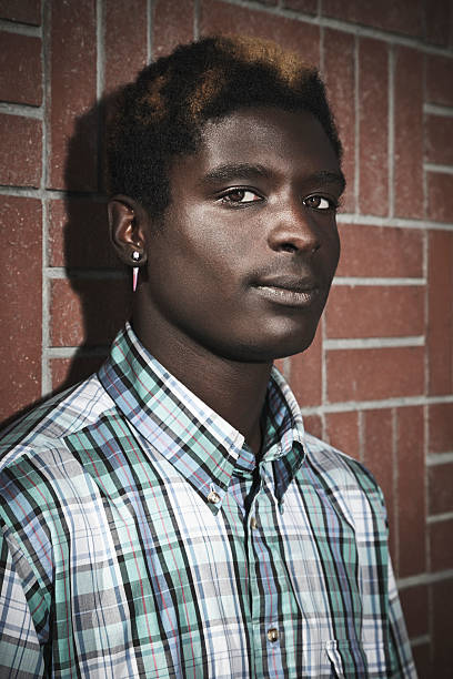 young african american man - earring human face brown hair black hair fotografías e imágenes de stock