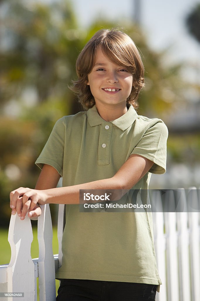 Portrait of a happy 10 year old boy 10 year old boy outdoors smiling in suburban setting. 10-11 Years Stock Photo