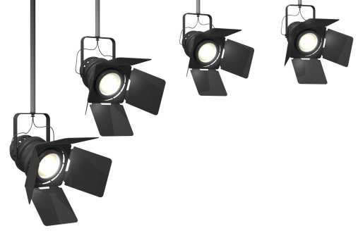 Four stage spotlights on a isolated on a white background.This is a detailed 3d rendering.