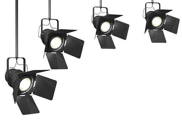 stage lights Four stage spotlights on a isolated on a white background.This is a detailed 3d rendering. stage light stock pictures, royalty-free photos & images