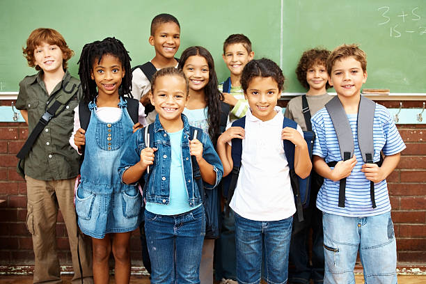 istock Happy group of school students standing together smiling 183242508