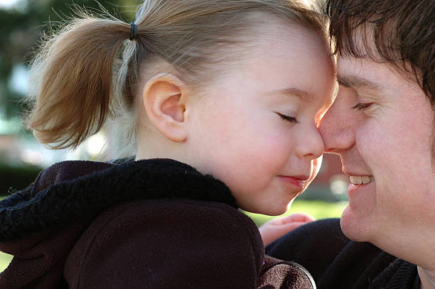 Color Image of Precious Moment Between Daughter and Daddy