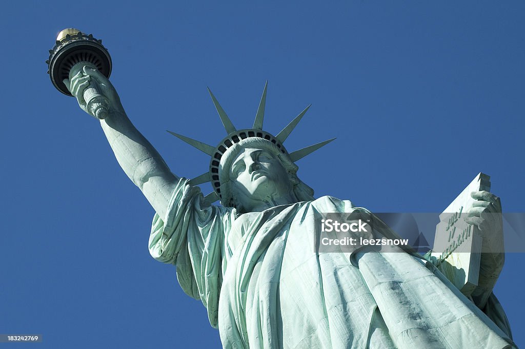 Statue of Liberty - Face, Torch, Tablet "Sharp and tilted angle looking up at the statue, against a perfectly clear blue sky.My other Statue of Liberty shots:" Statue of Liberty - New York City Stock Photo