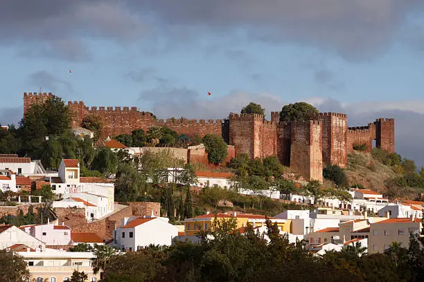 "The historic moorish castle in Silves, Algarve, Portugal. Silves Castle was built between the 8th and the 13th century AD and is considered to be the best preserved of the Moorish castles of the country."