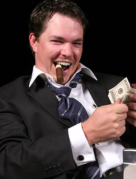 the сутенёр: переворачивание деньги. - greed currency men happiness стоковые фото и изображения