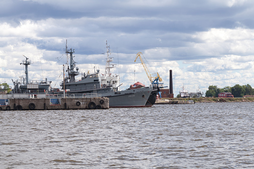 Kronstadt, Russia - August 7, 2022: PZhS-282, Russian fire fighting vessel is moored at the Middle Harbor, naval base of Kotlin island