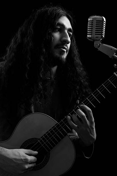 istock Oldies rock star singing on classic microphone 183244416