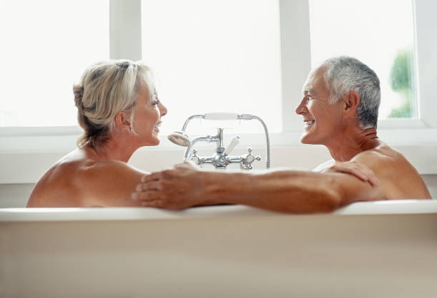 istock Romantic mature couple enjoying and having fun in bathtub 183244425