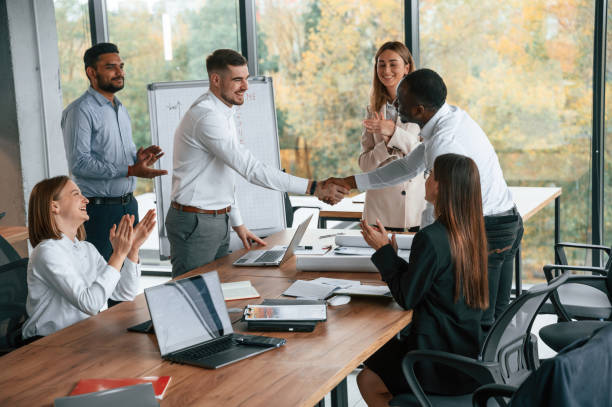 istock Successful agreement, making handshake. Group of office workers are together indoors 1832444542