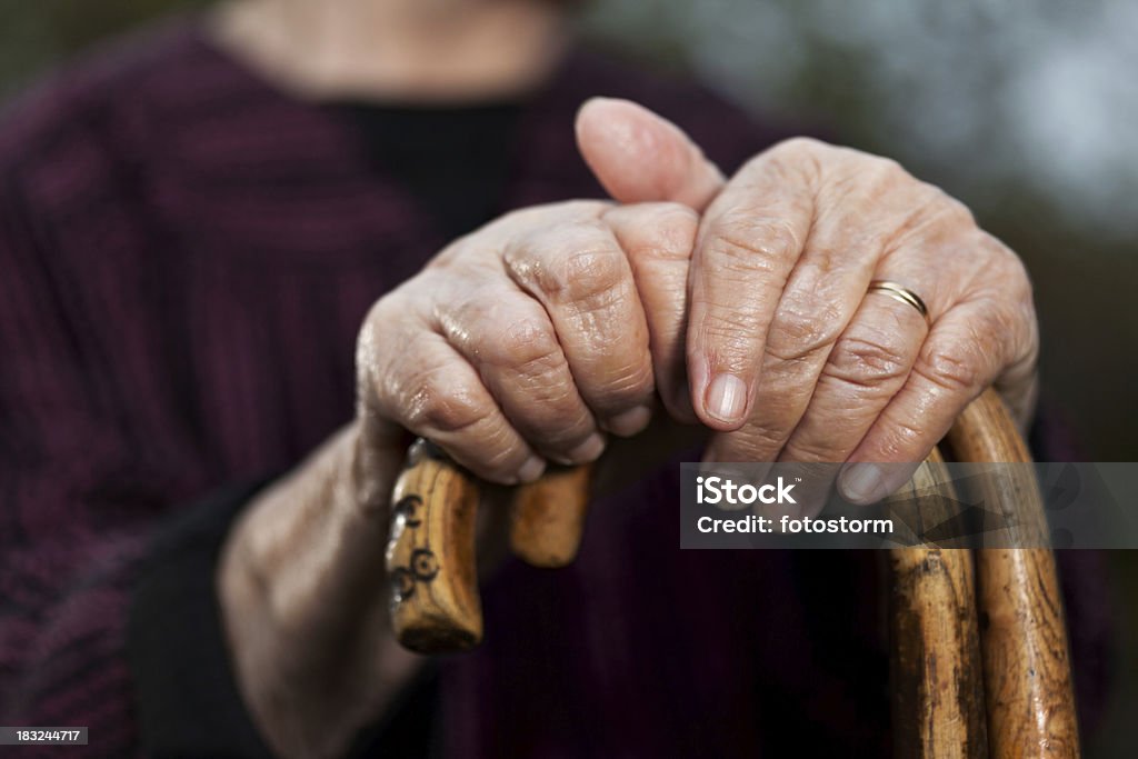 Close-up of senior woman's hands holding her walking sticks Close-up of senior woman's hands holding her walking sticks. Selective focus on hands and sticks. Senior Women Stock Photo