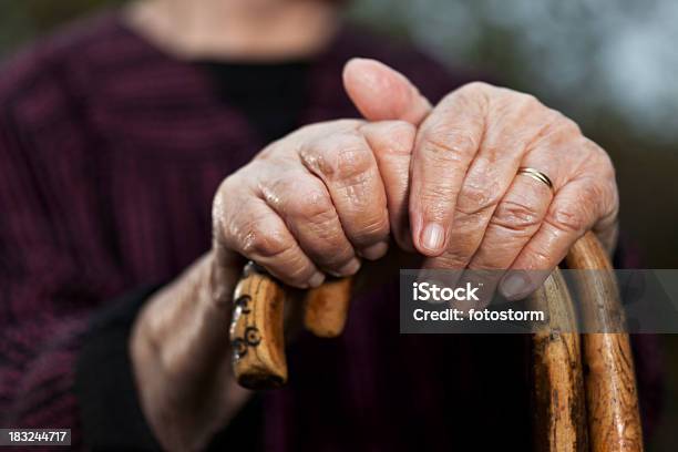 Closeup Of Senior Womans Hands Holding Her Walking Sticks Stock Photo - Download Image Now