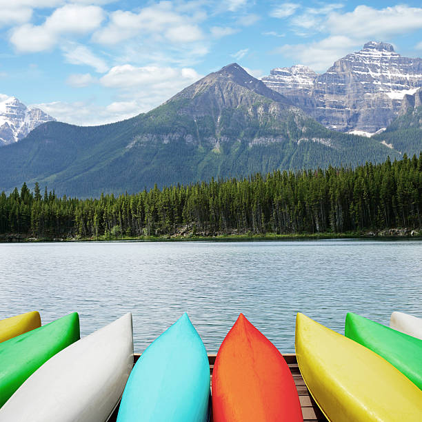 istock XL canoes and mountain lake 183245201