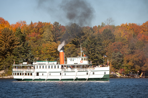A steamship. Muskoka region of Ontario, Canada. This nautical vessel operates in Muskoka near Gravenhurst. The trip offers passengers a relaxing journey along a scenic tree and cottage-lined lake in the beautiful Muskoka region, which lies just north of Toronto. The scenic tour operates until Thanksgiving weekend. Wooden steamships are rare in the world. 