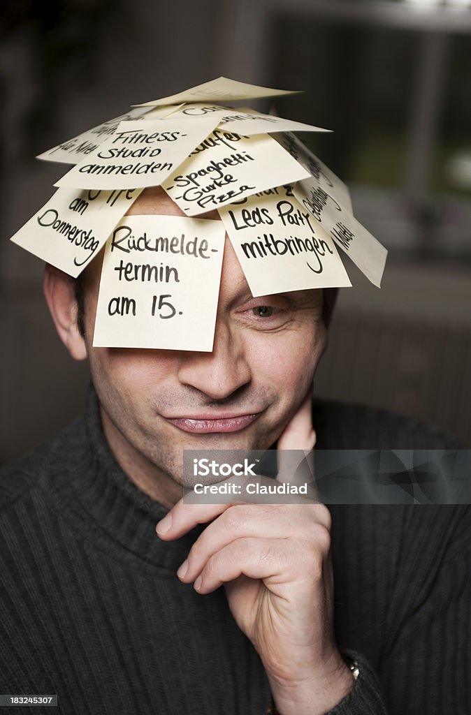 Funny looking man with stickers Confused man with stickers on his head. 30-39 Years Stock Photo